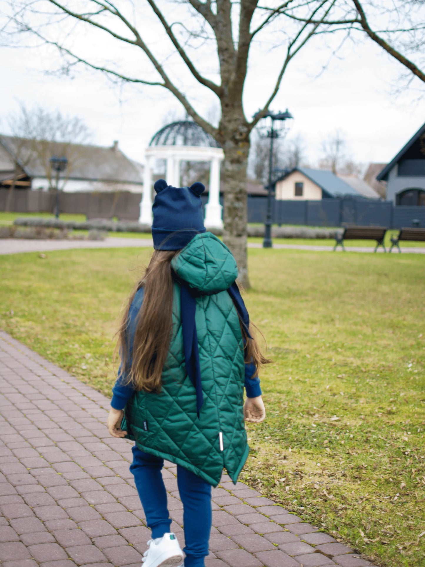 Gray children's vest with a hood